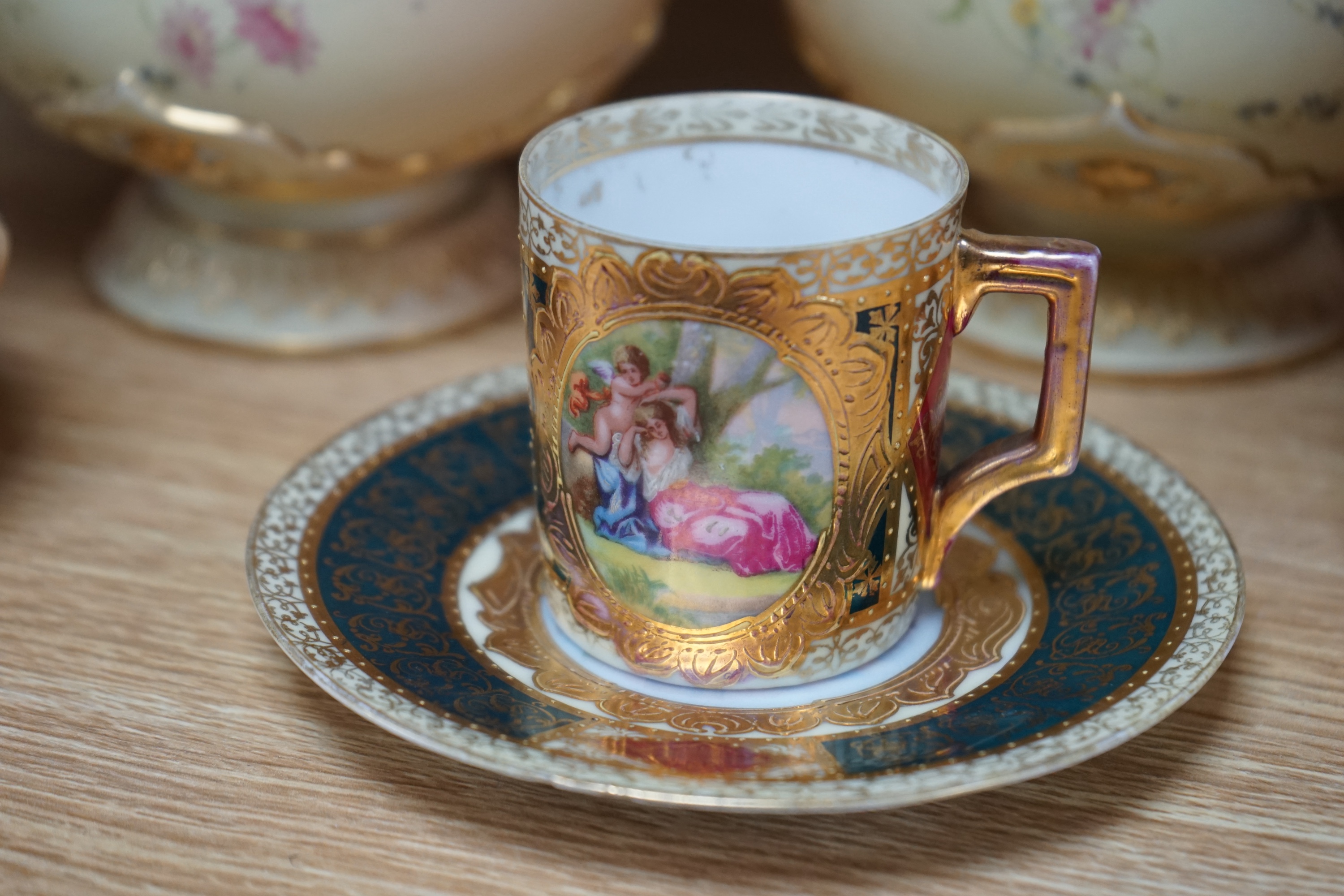 Two pairs of Royal Worcester blush ivory vases, model numbers 2332 and 1626 and Vienna type coffee can with saucer, tallest 22cm. Condition - good